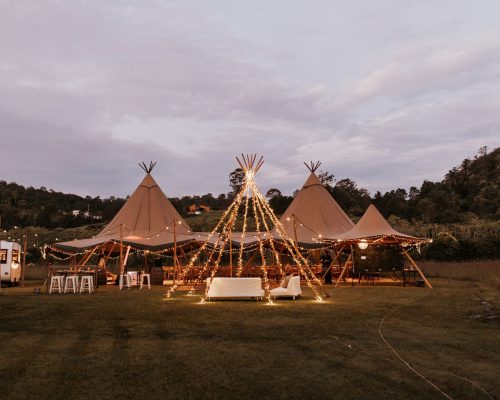 Lit tipi wedding reception at dusk at The Rocks Yandina